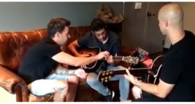 Watch Jeff and Pierre give guitar lessons to a fan